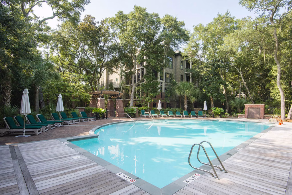 The Maritime private community pool is meticulously landscaped and features an outdoor kitchen with grill and wet bar. A beautiful brick fireplace serves as a perfect backdrop to celebrate summer evenings.